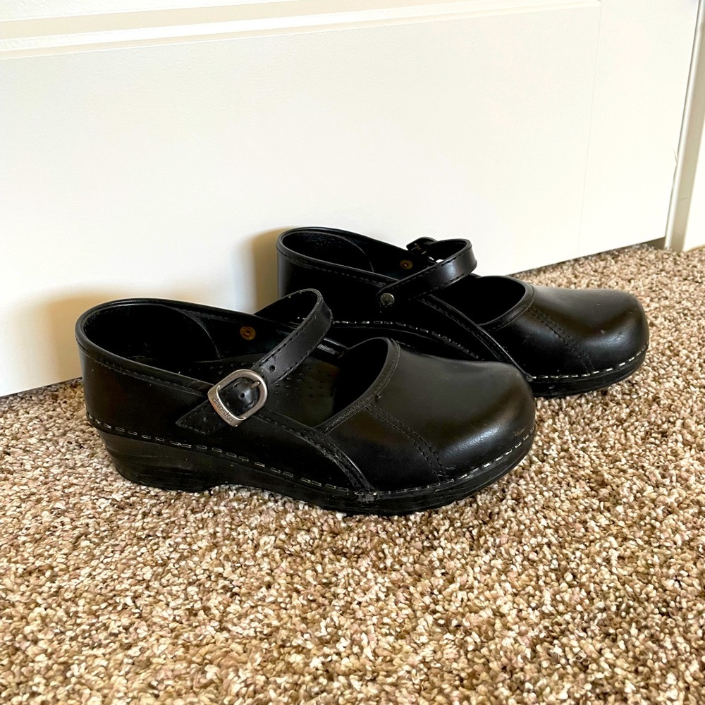 Black Dansko clogs with strap